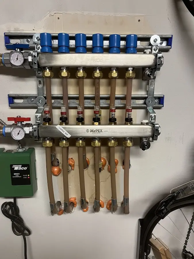 Plumber performing Water Heater Repair at a residential property in Chanute